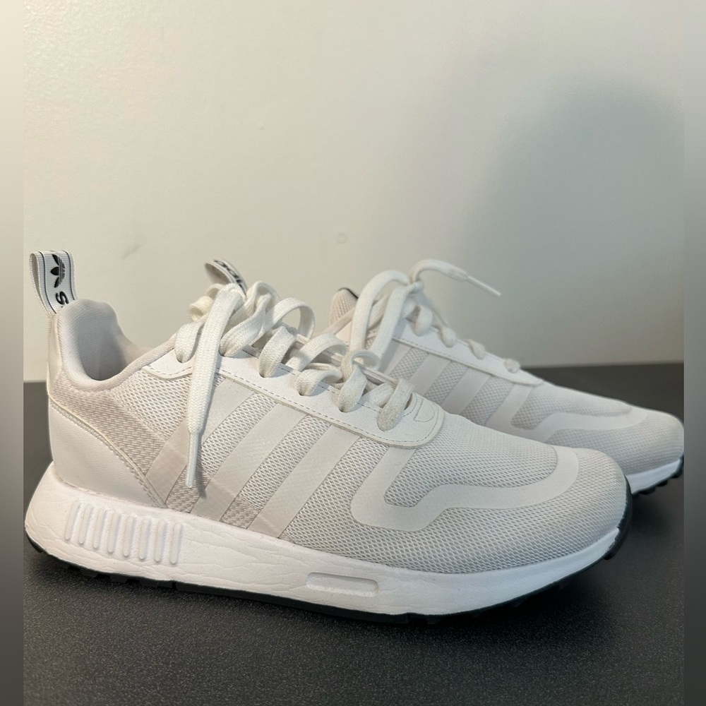 Women’s white adidas sneakers